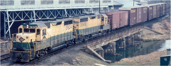 On March 5, 1976, a few weeks before the advent of Conrail, a pair of GP-35s hauls train RW-5 along the Reading's Wilmington & Northern Branch at Valley, PA, just north of Coatesville.  The hi-cube boxcars contain auto parts for the GM plant in Wilmington.  Photo courtesy of Richard W. Jahn.