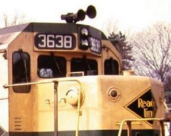 A detail view of the electronic bell on the short hood of Reading GP-35 #3638.