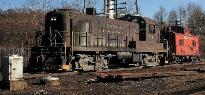 Reading RS-3 #514 in Allentown Yard coupled to a Lehigh Valley northeastern caboose.